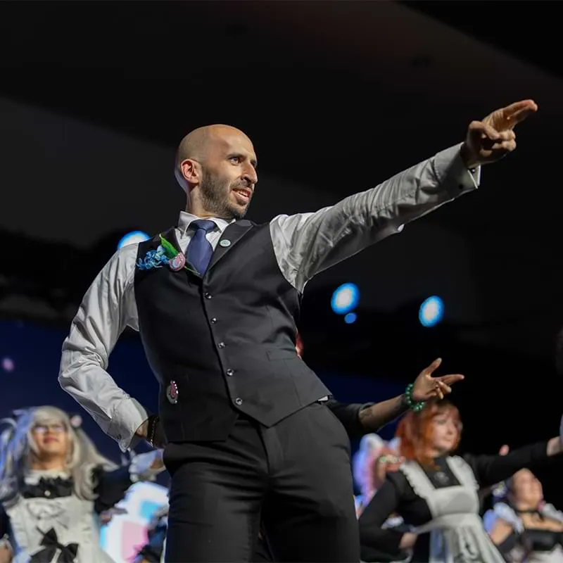 A butler holding a finishing dance move